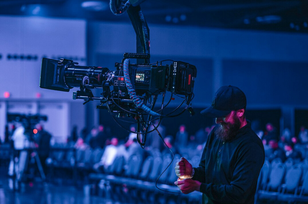 Live broadcast control room with multiple camera monitors